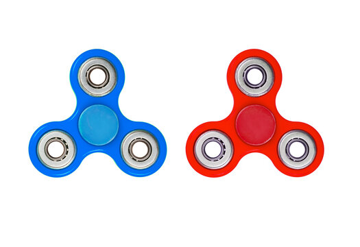 Two colorful fidget spinners in blue and red hues placed side by side isolated on transparent background