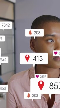 Woman turning toward camera in office as incoming pins hearts bells popping, driving marketing