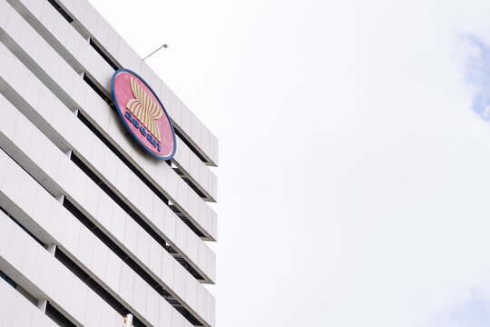 ASEAN Secretariat building with member country flags waving in front of modern office architecture in Jakarta, symbol of regional cooperation and diplomacy