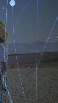 Vertical video: Helmeted techs entering left, standing, overlay highlighting harnesses for ropework
