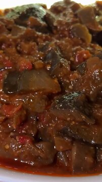 Zacusca - Romanian food. Slices of bread with vegetable spread, roasted eggplant, onions, tomato paste and roasted red peppers. Autumn and vegetarian food.