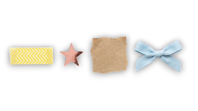 Playful craft flat lay with yellow chevron washi tape foil star torn paper and blue bow on a transparent background