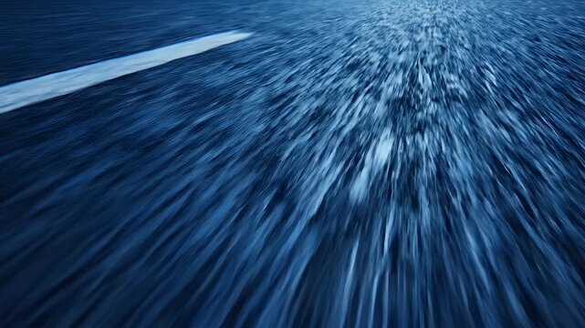 A long exposure photograph captures the dynamic movement of water, creating a blurred, abstract effect.