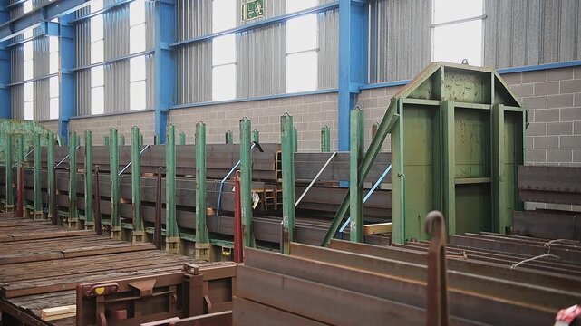 freight train wagons moving inside an industrial warehouse