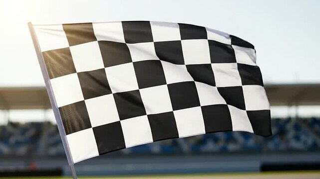 A checkered flag waving in the wind, representing the end of a competition or race