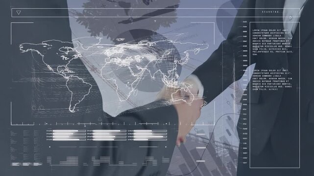 Animation of data processing over building site and caucasian business people shaking hands