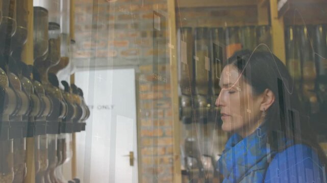Vertical video: Shopper looking up at boots and activating wavy overlays while using phone buying