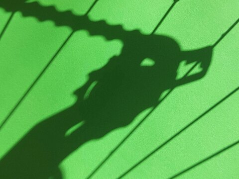 Abstract green shadow pattern on textured background