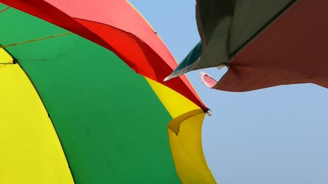 Closeup of colorful umbrellas installed for tourists | Marari Beach, Alappuzha, Kerala, India
