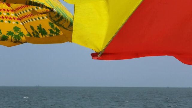 Closeup of colorful umbrellas installed for tourists | Marari Beach, Alappuzha, Kerala, India