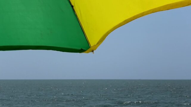 Closeup of colorful umbrella installed for tourists | Marari Beach, Alappuzha, Kerala, India