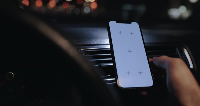 Person using smartphone with empty screen in a car, tap and zoom out gesture