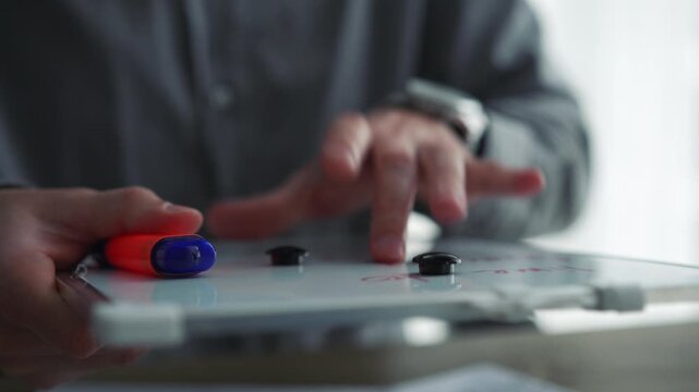 Man presenting a business plan to colleagues on the board.
Discussion of financial strategies, business plan development.
Corporate development strategy