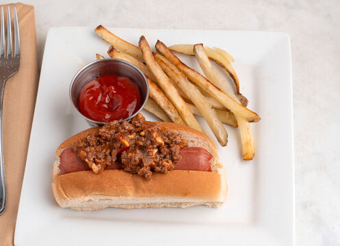 hot dog top with sloppy joe  served with french fries