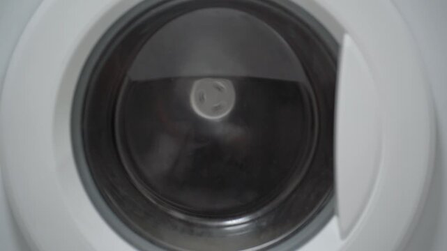 Rinsing and wringing shoes in a household washing machine