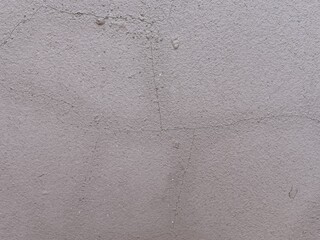 Obraz premium Grungy gray cement wall texture with weathered surface and industrial concrete cracks