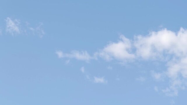 Cirrocumulus clouds moving in the sky in afternoon