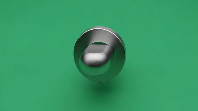 Metallic toggle switch button displays a smooth brushed silver texture against a vibrant flat green background while floating in a clean studio environment.