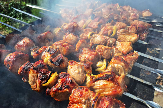 Grilled meat skewers on charcoal
