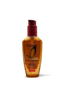 Photo of a bottle of L&rsquo;Or&eacute;al Elvive extraordinary oil for dry and colored hair, isolated on white background. L'Or&eacute;al is a French multinational personal care corporation headquartered in Clichy.