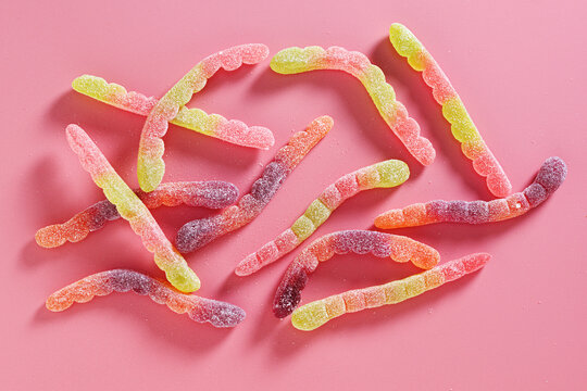 Sour gummy worms candy pile