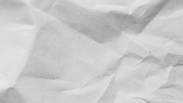 White crumpled paper texture background with soft wrinkles and realistic surface detail