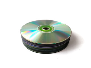 Fototapeta premium A stack of compact discs (CDs) sits on a flat white surface.