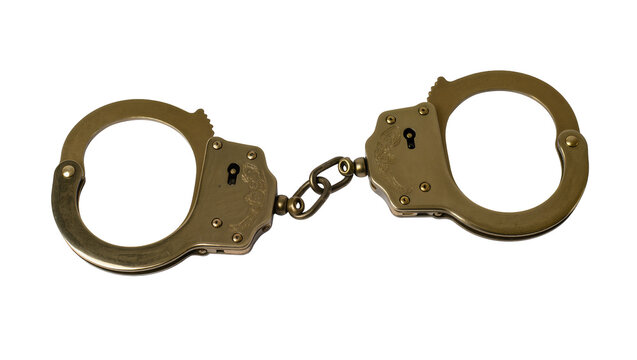 Isolated vintage decorative brass handcuffs with link chain, symbol of justice and arrest