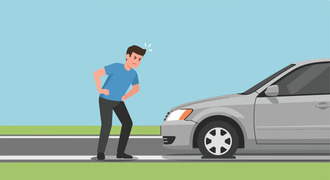 Angry driver frustrated by a flat tire on a silver car beside the paved roadside