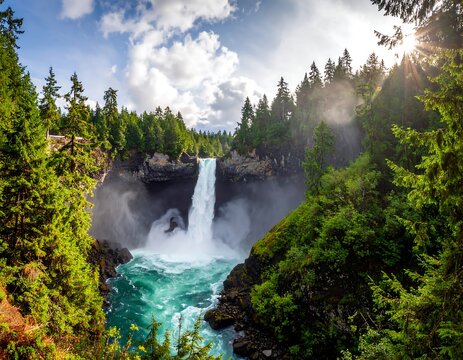 Waterfall plunges powerfully into turquoise pool, framed by lush green forest and sunlit sky