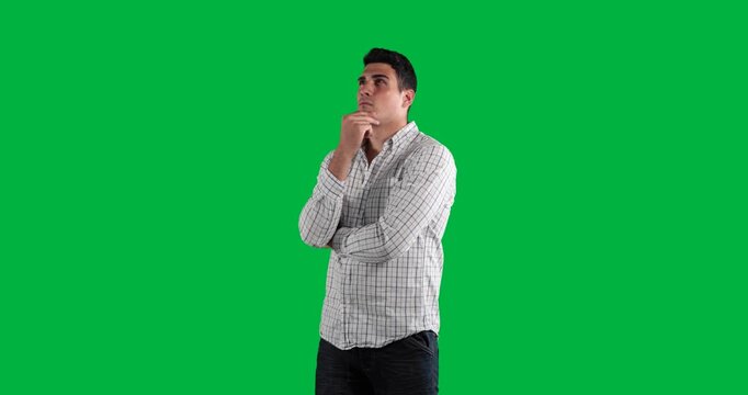 Uncertain caucasian man finding inspiration on transparent background with green shape