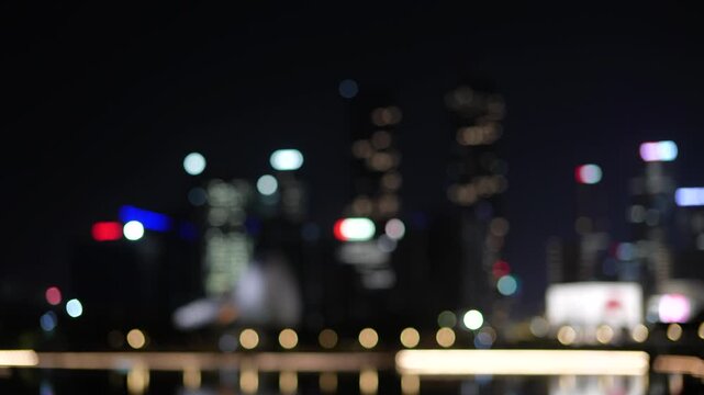Abstract urban night background with colorful bokeh lights