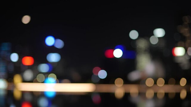 Night Shenzhen city skyline with defocused skyscrapers and bokeh.