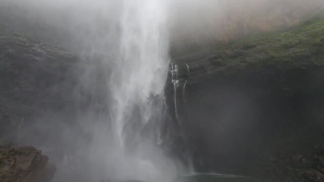 Nanemachi Waterfall thunders through deep Sahyadri valleys, wrapped in mist and lush greenery, creating a breathtaking monsoon scene filled with raw natural beauty. 