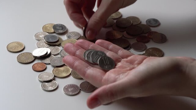romanian coins counting in hands