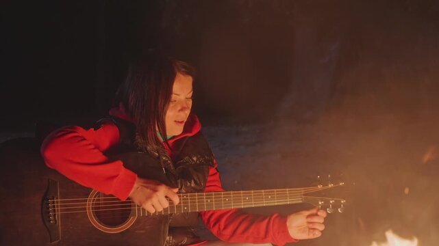 Quiet firelit guitar session. Silent woodland evening with gentle guitar melodies and warm glow. An intimate night in woods featuring soft guitar tunes and peaceful ambiance under stars