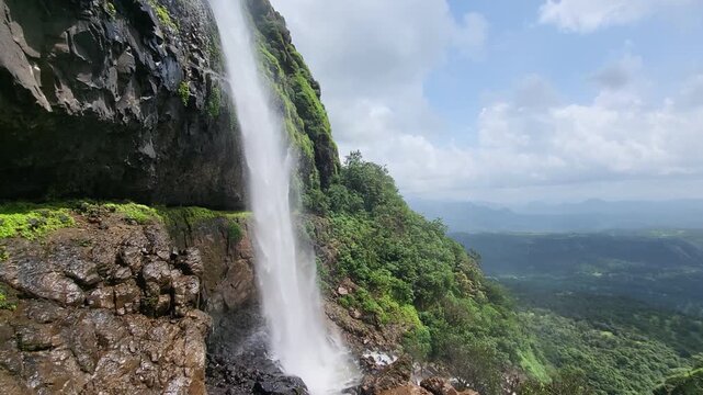 Laxmi Waterfall at Madhe Ghat pours gracefully down towering cliffs in stunning 4K, surrounded by mist, deep valleys, and the wild beauty of Sahyadri monsoon magic.