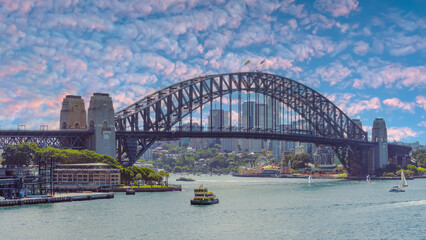 Naklejka premium Panoramic view of Sydney Harbour and Circular Quay on a Beautiful Autumn Afternoon lovely colours of the sky in Sydney NSW Australia