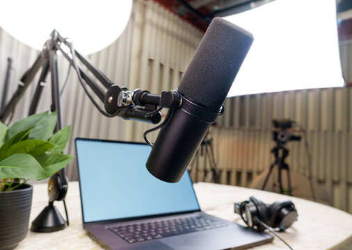 Professional podcast studio equipment microphone headphones laptop smartphone cameras videocast podcast