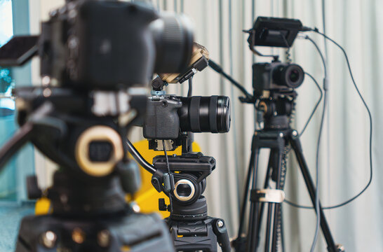Professional video cameras monitors tripod broadcast studio videocast vlog production