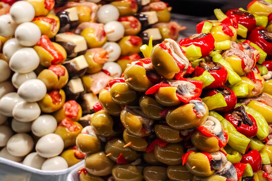 Skewers with olives, peppers or other ingredients in the form of banderillas in San Miguel market, Madrid.