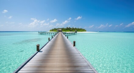 Fototapeta premium Tropical pier leads to a secluded island paradise. Tranquil turquoise water meets a light brown wooden pier stretching to a small island with a thatched roof building.