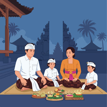 A Balinese family sitting on a mat with offerings in front of a temple at night