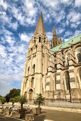 Fototapeta premium Chartres Cathedral stands tall against the blue sky in Chartres France