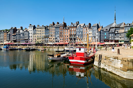Harbour scene in Honfleur Normandy with boats and buildings