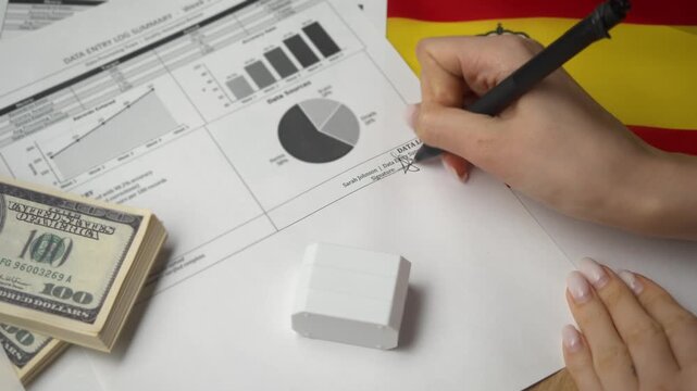 Meticulous clerk wraps data entry ledger for international Spanish firm applying red entered stamp to deter re-logging aiding thorough inspections.