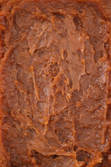 Obraz premium salt caramel paste texture, caramel spreadable cream close up, caramel spread