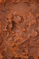 Fototapeta premium salt caramel paste texture, caramel spreadable cream close up, caramel spread