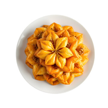 Traditional Moroccan chebakia sesame flower-shaped pastry drizzled with honey and sprinkled with sesame seeds.