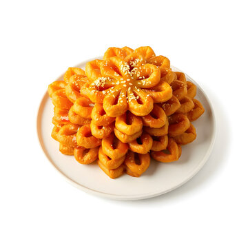 Traditional Moroccan chebakia sesame flower-shaped pastry drizzled with honey and sprinkled with sesame seeds.